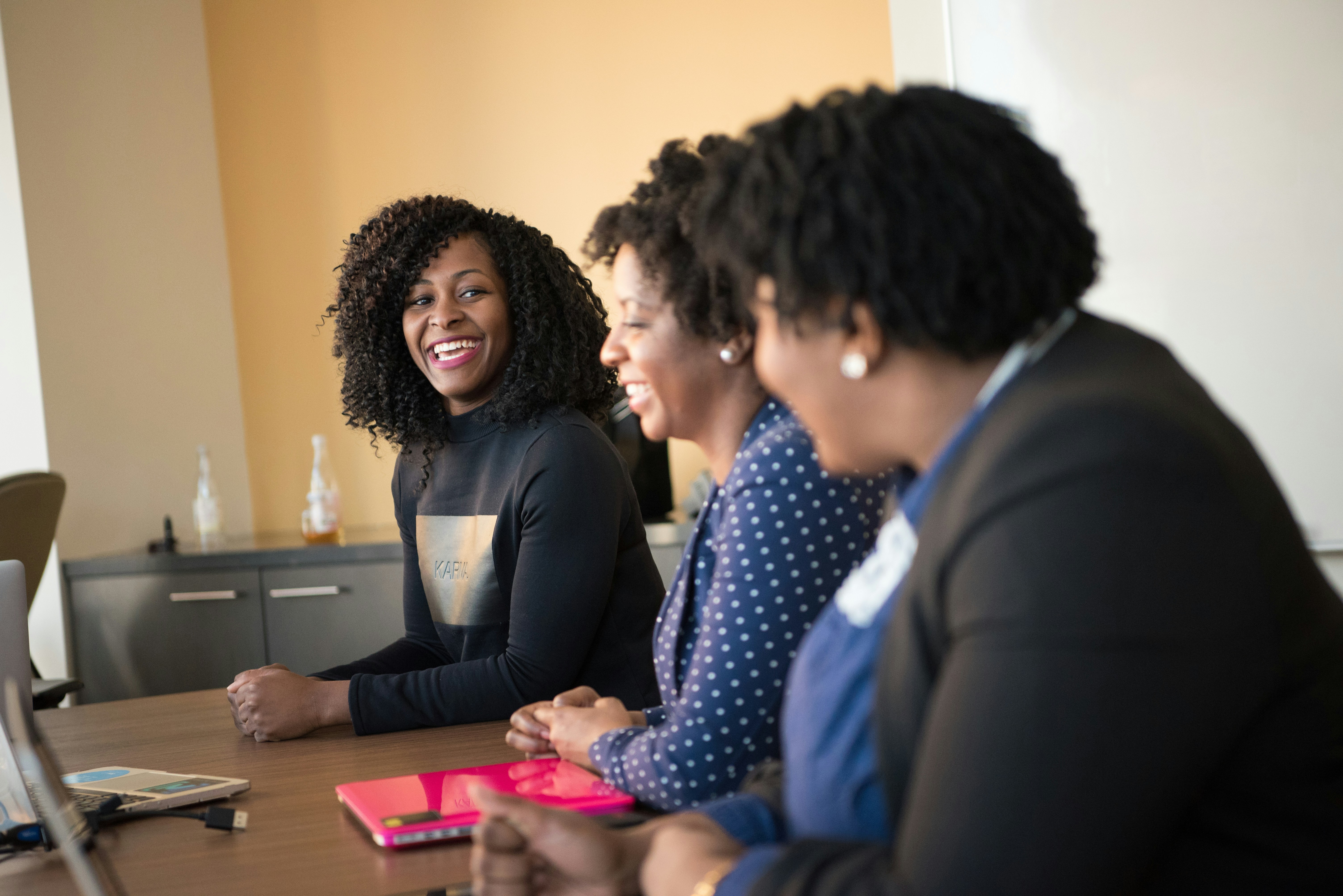 Women in conversation around a table